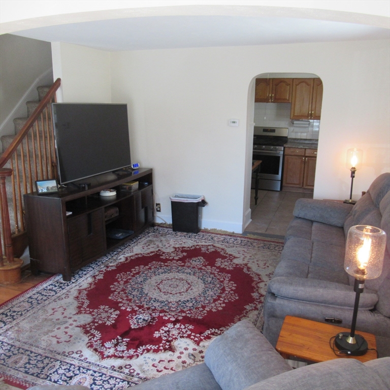 29 Villa Avenue Everett, MA 02149 - Photo 13 of 16 a living room with furniture and a flat screen tv
