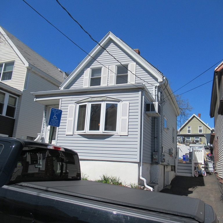 29 Villa Avenue Everett, MA 02149 - Photo 2 of 16 a front view of a house with a yard
