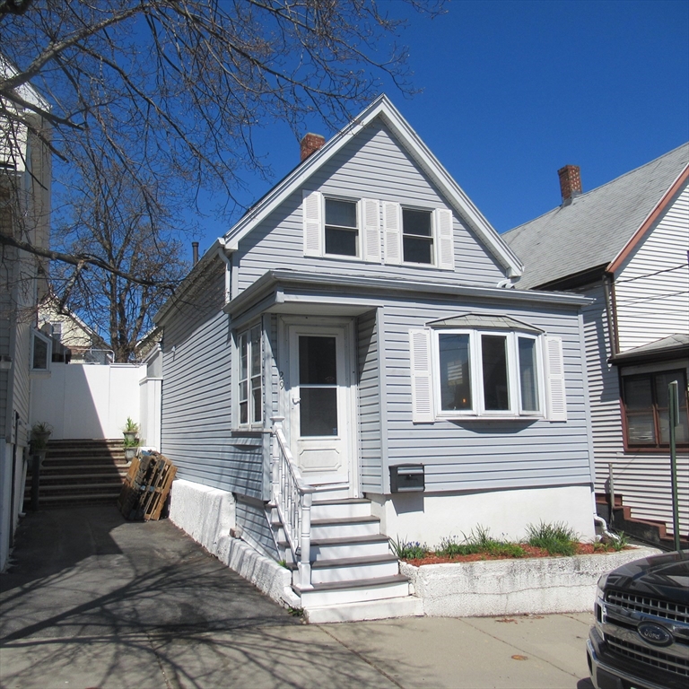 29 Villa Avenue Everett, MA 02149 - Photo 3 of 16 a front view of a house with a yard