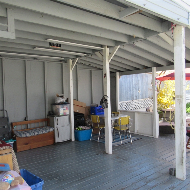 29 Villa Avenue Everett, MA 02149 - Photo 4 of 16 a view of game room with wooden floor and furniture