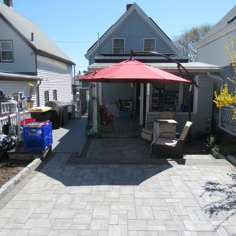 29 Villa Avenue Everett, MA 02149 - Photo 7 of 16 a view of a chairs and table in the patio