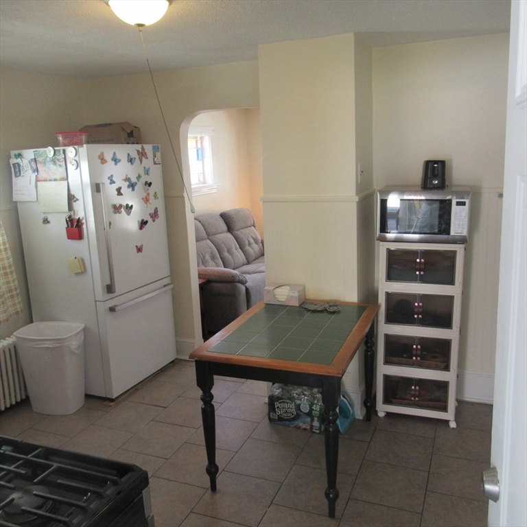 29 Villa Avenue Everett, MA 02149 - Photo 8 of 16 a room with furniture a rug and a wall painting