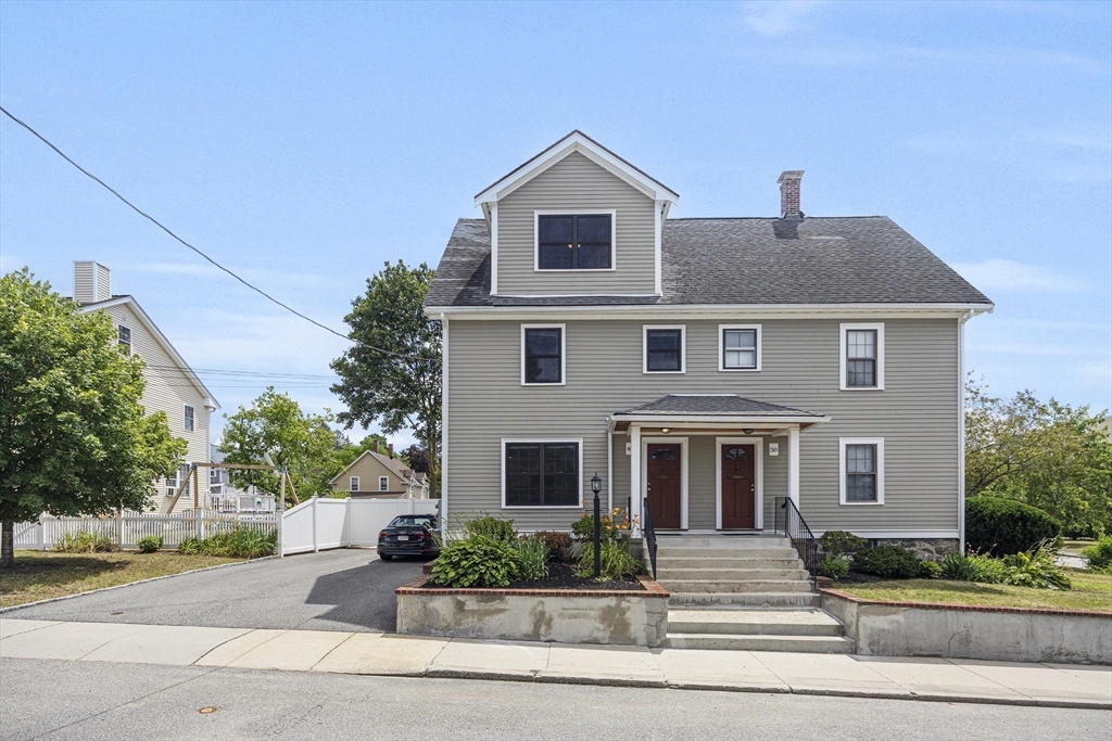48 Spruce Street, Unit 1 Winchester, MA 01890 - Photo 22 of 29 a front view of a house with a yard