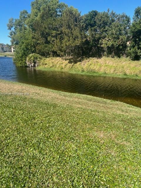 a view of a lake with a yard