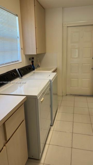 135 Brier Circle Jupiter, FL 33458 - Photo 13 of 14 a room with washing machine and cabinets