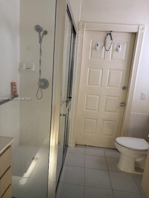 135 Brier Circle Jupiter, FL 33458 - Photo 10 of 14 a bathroom with a granite countertop shower and a toilet