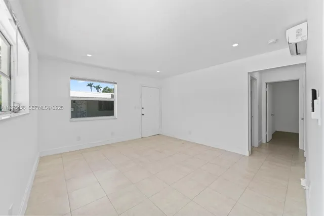 an empty room with a bathroom