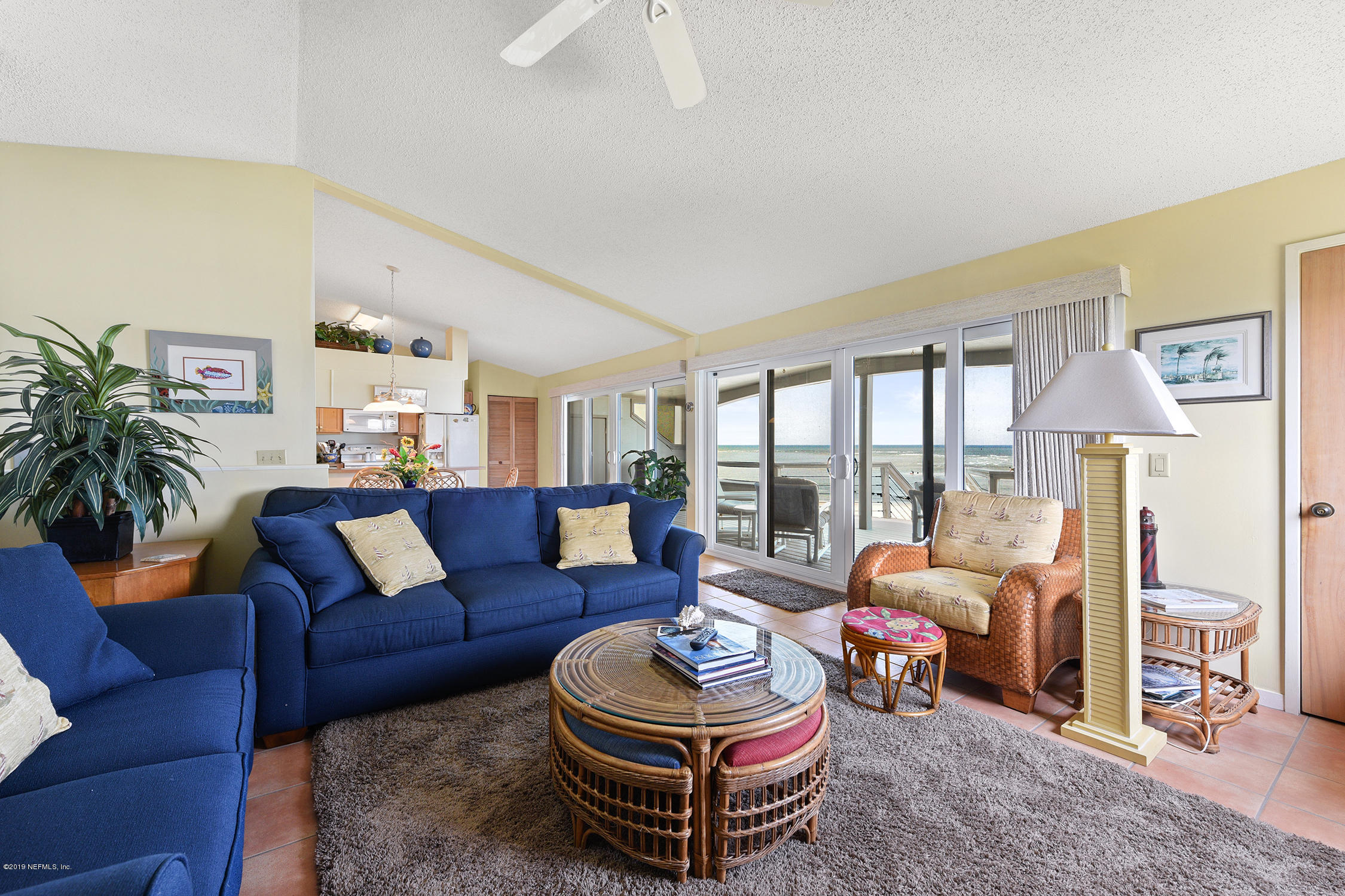 8850 Old A1A, Unit 9 St. Augustine, FL 32080 - Photo 12 of 37 a living room with furniture and a large window