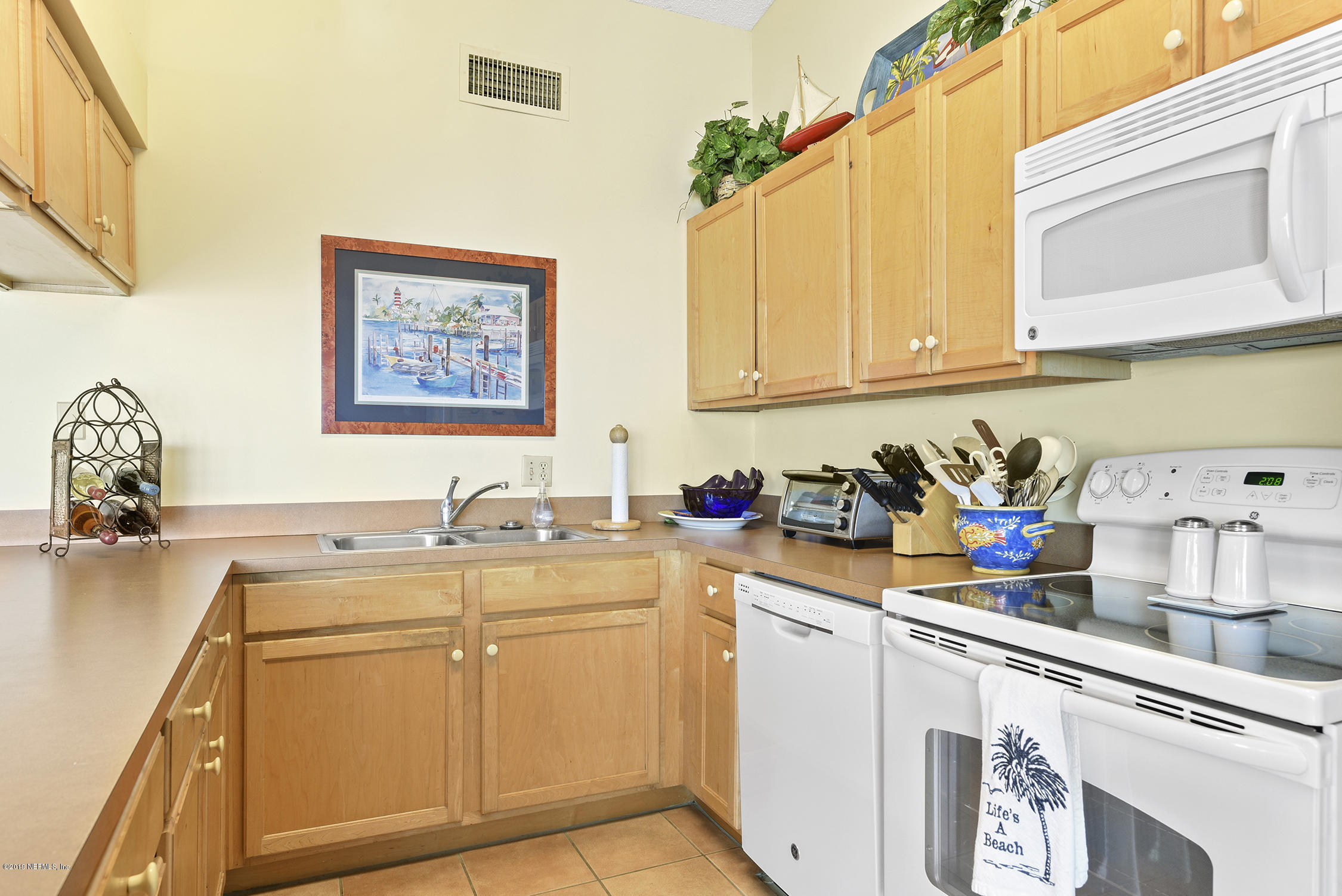 8850 Old A1A, Unit 9 St. Augustine, FL 32080 - Photo 15 of 37 a view of a kitchen with sink and cabinets