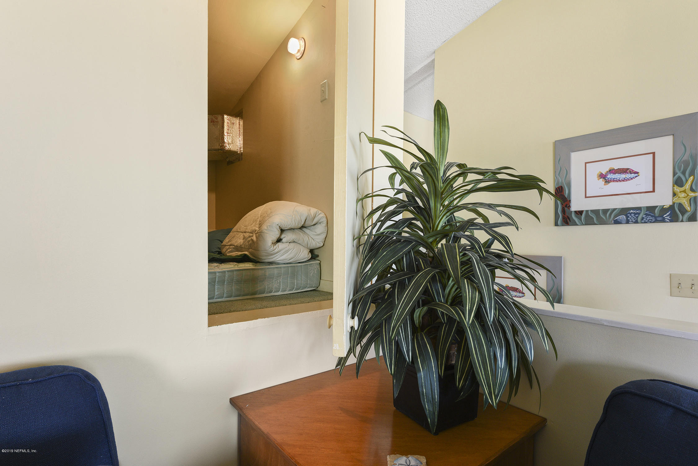 8850 Old A1A, Unit 9 St. Augustine, FL 32080 - Photo 19 of 37 a view of a potted plant with a chair and a potted plant