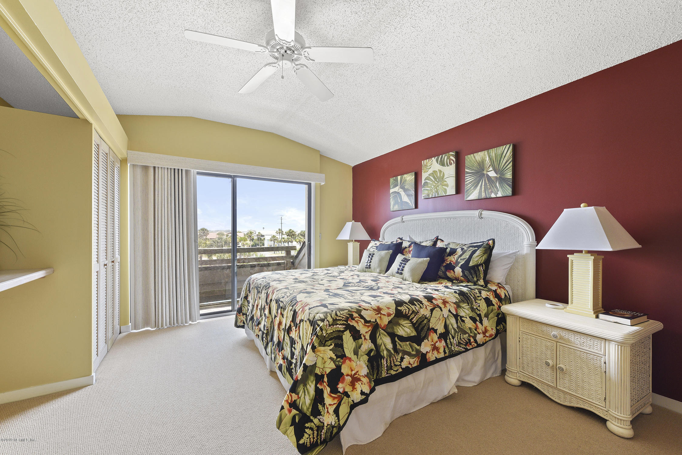 8850 Old A1A, Unit 9 St. Augustine, FL 32080 - Photo 25 of 37 a bed sitting in a spacious bedroom next to a window