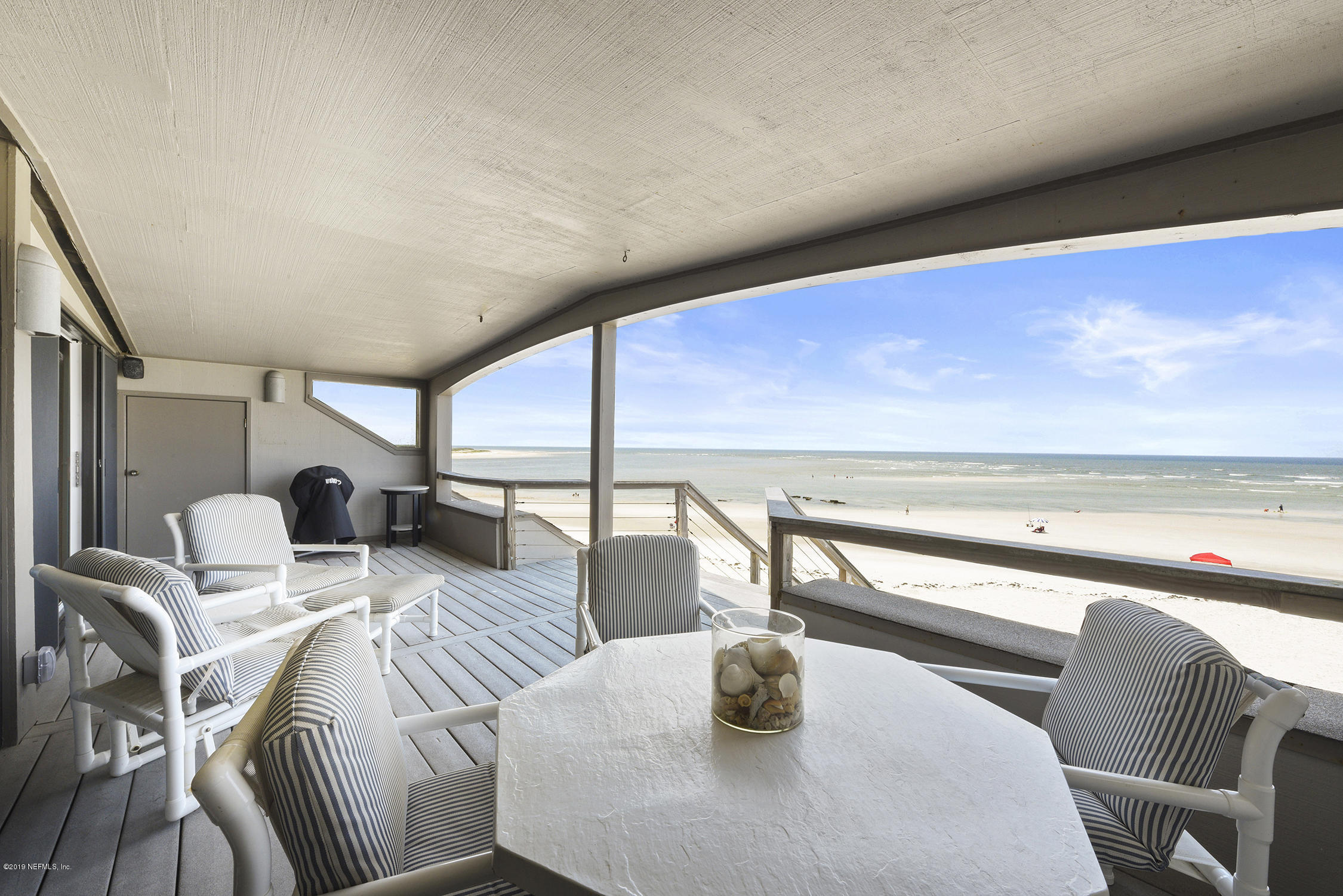 8850 Old A1A, Unit 9 St. Augustine, FL 32080 - Photo 3 of 37 a dining room with furniture and wooden floor