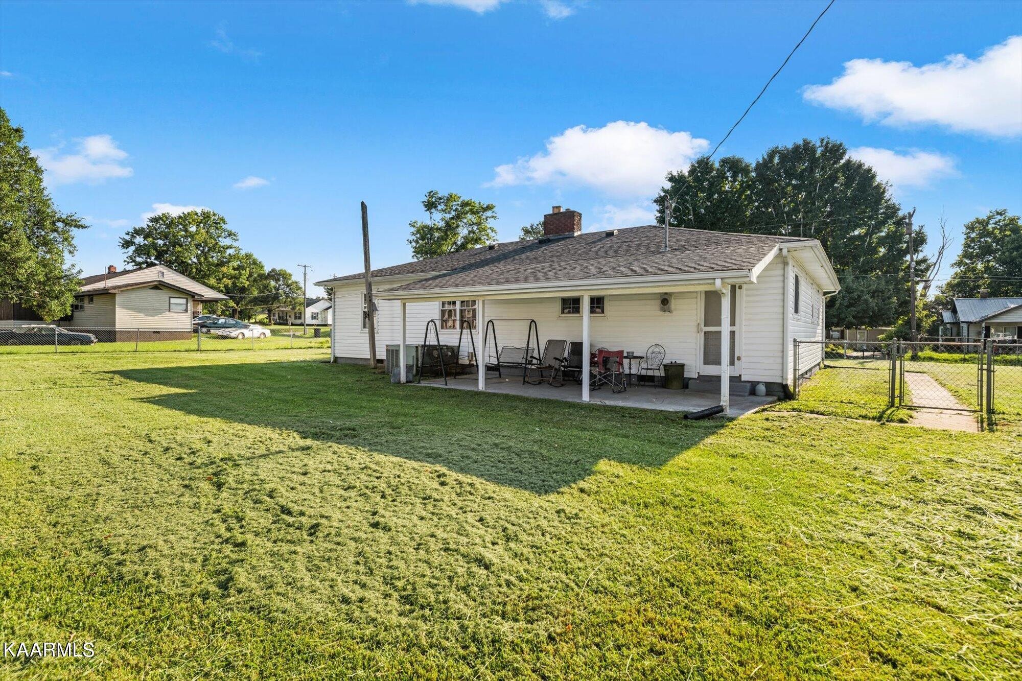 1211 Spring Street Philadelphia, TN 37846 - Photo 14 of 25 a view of a house with a yard