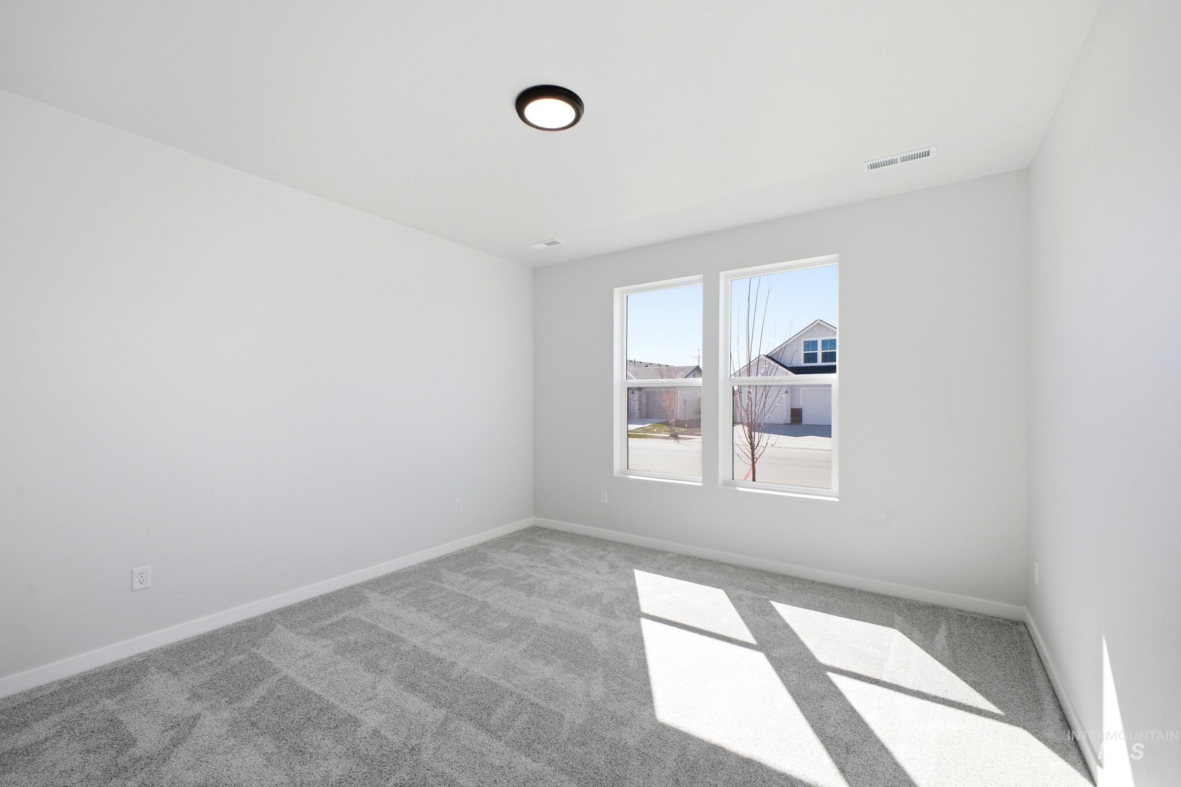 13633 Redway Court Caldwell, ID 83607 - Photo 16 of 29 Unfurnished room featuring light carpet and baseboards