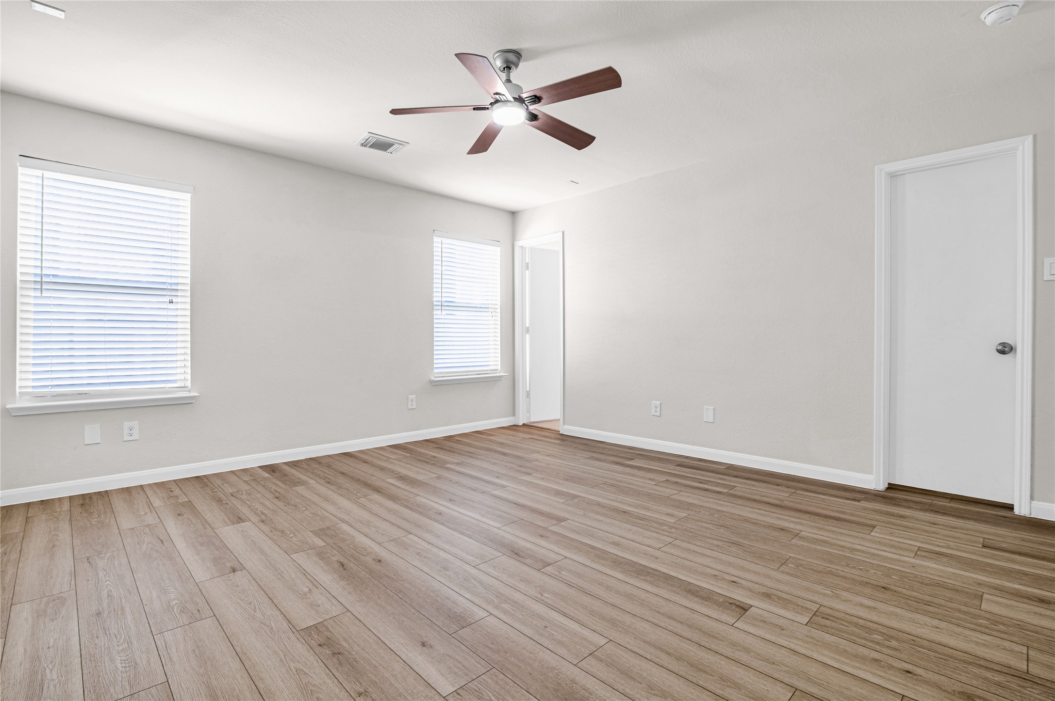 29514 North Legends Bend Drive Spring, TX 77386 - Photo 11 of 19 The spacious primary bedroom features a private en-suite bath and a walk-in closet, creating a comfortable and relaxing retreat.