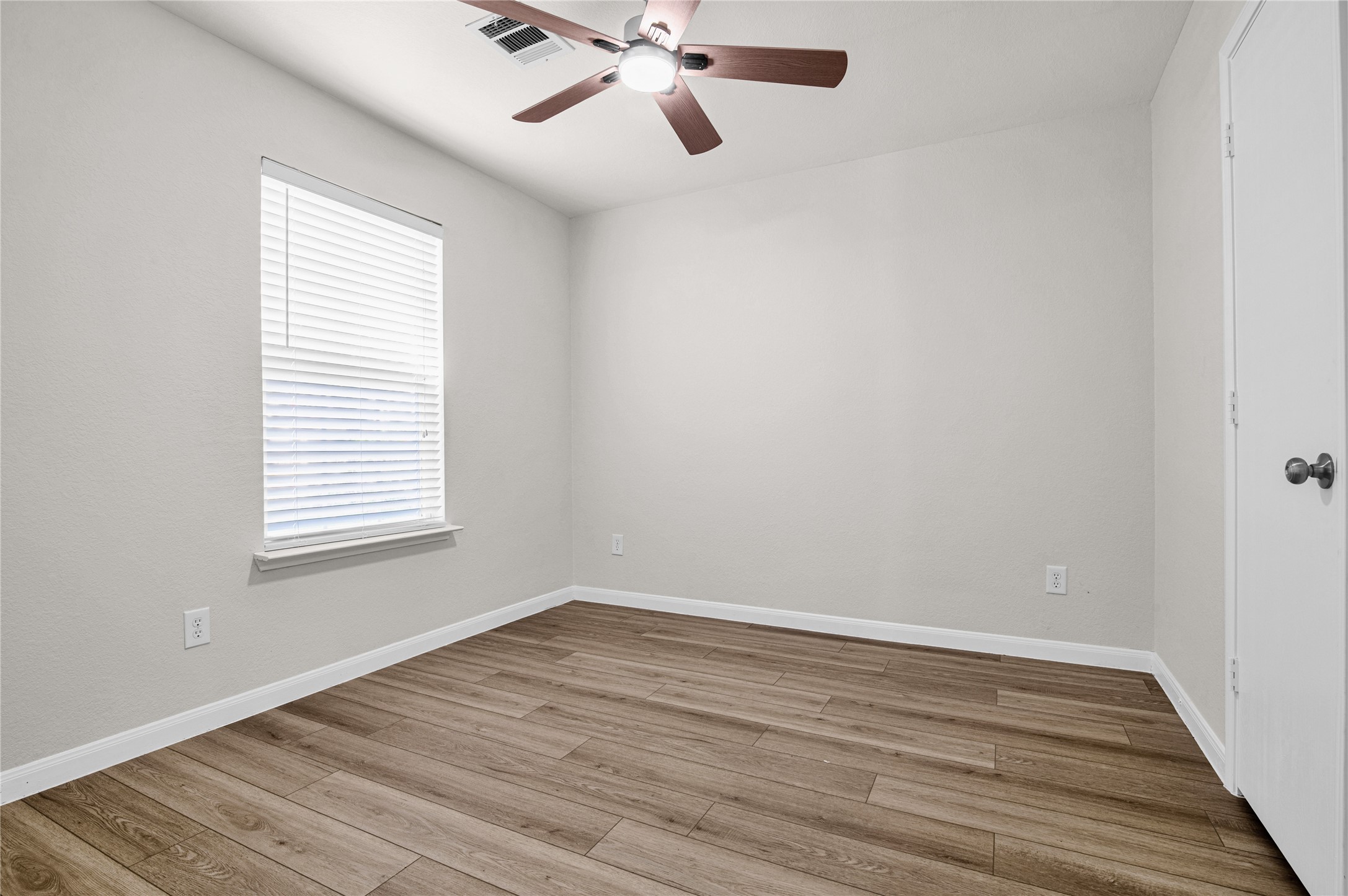 29514 North Legends Bend Drive Spring, TX 77386 - Photo 14 of 19 The third bedroom features a walk-in closet and a spacious layout, ideal for family members, guests, or a flexible living space.