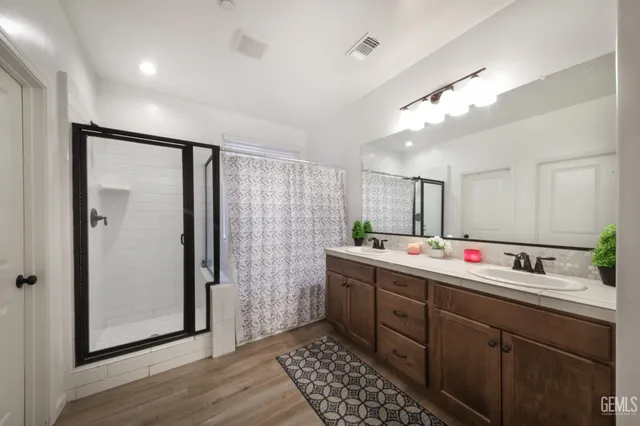 a view of a kitchen with a sink and wooden floor