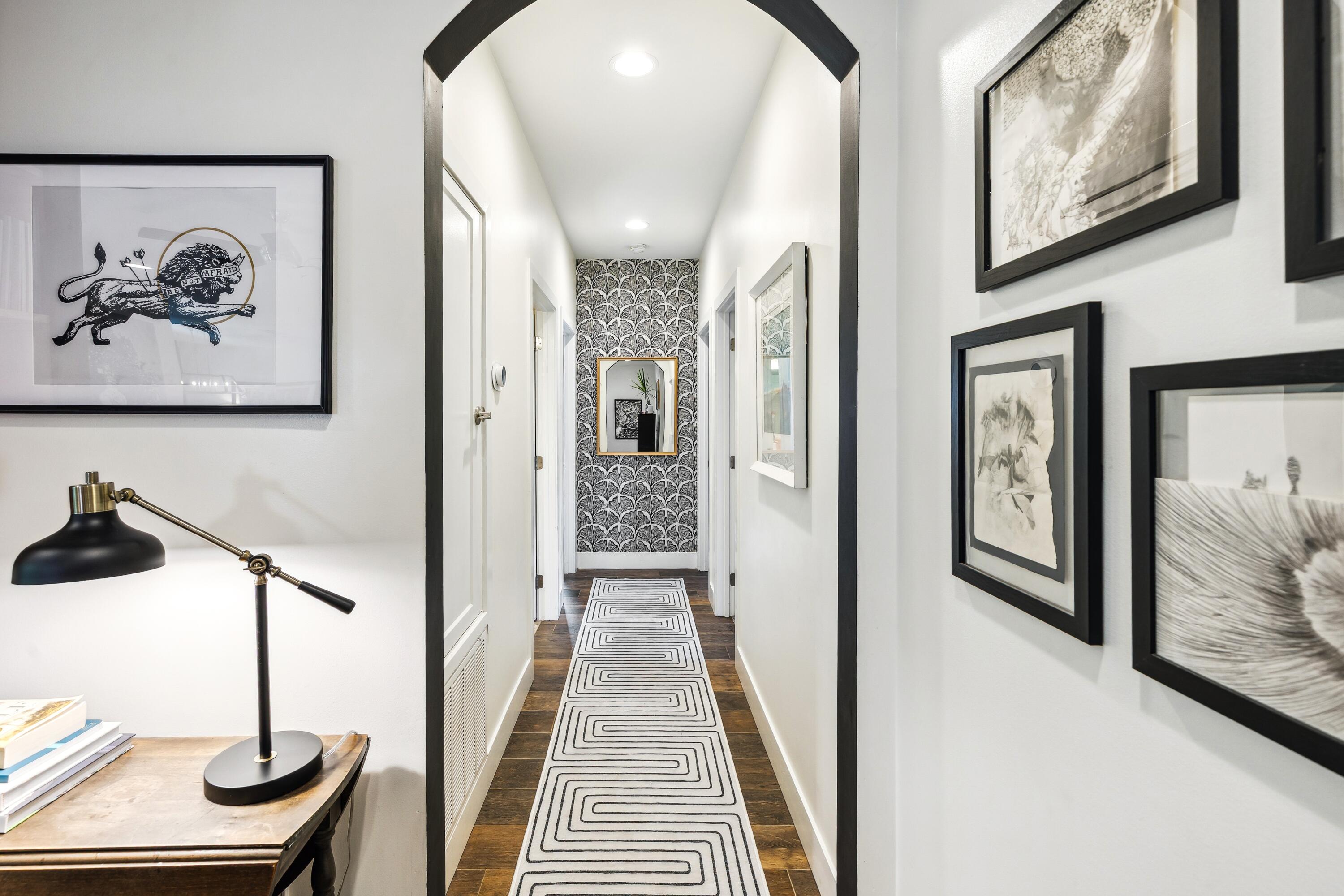 209 Forest Park Drive Santa Rosa Beach, FL 32459 - Photo 21 of 49 a view of a hallway with wooden floor and furniture