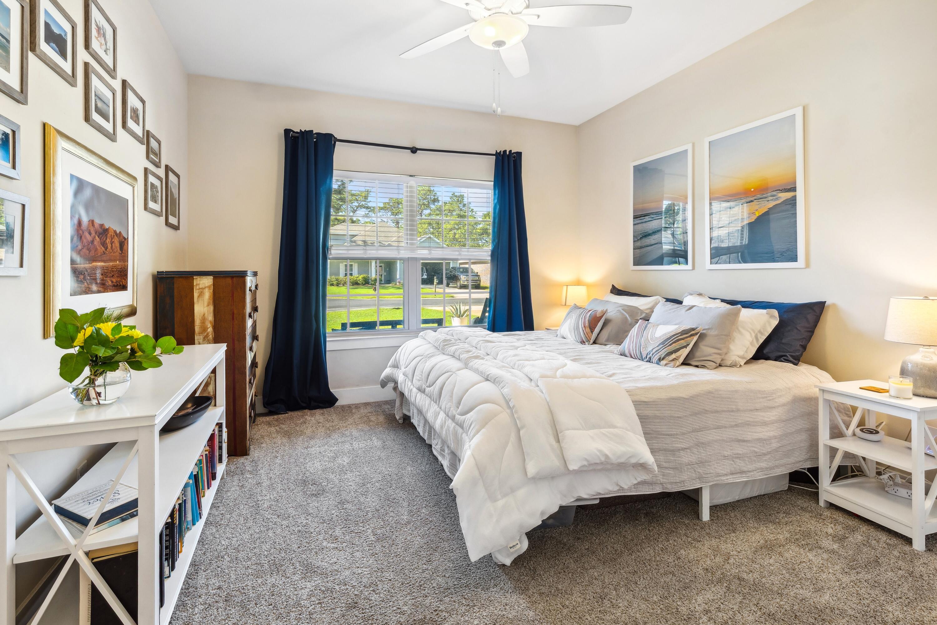 209 Forest Park Drive Santa Rosa Beach, FL 32459 - Photo 22 of 49 a bedroom with a bed table and chair