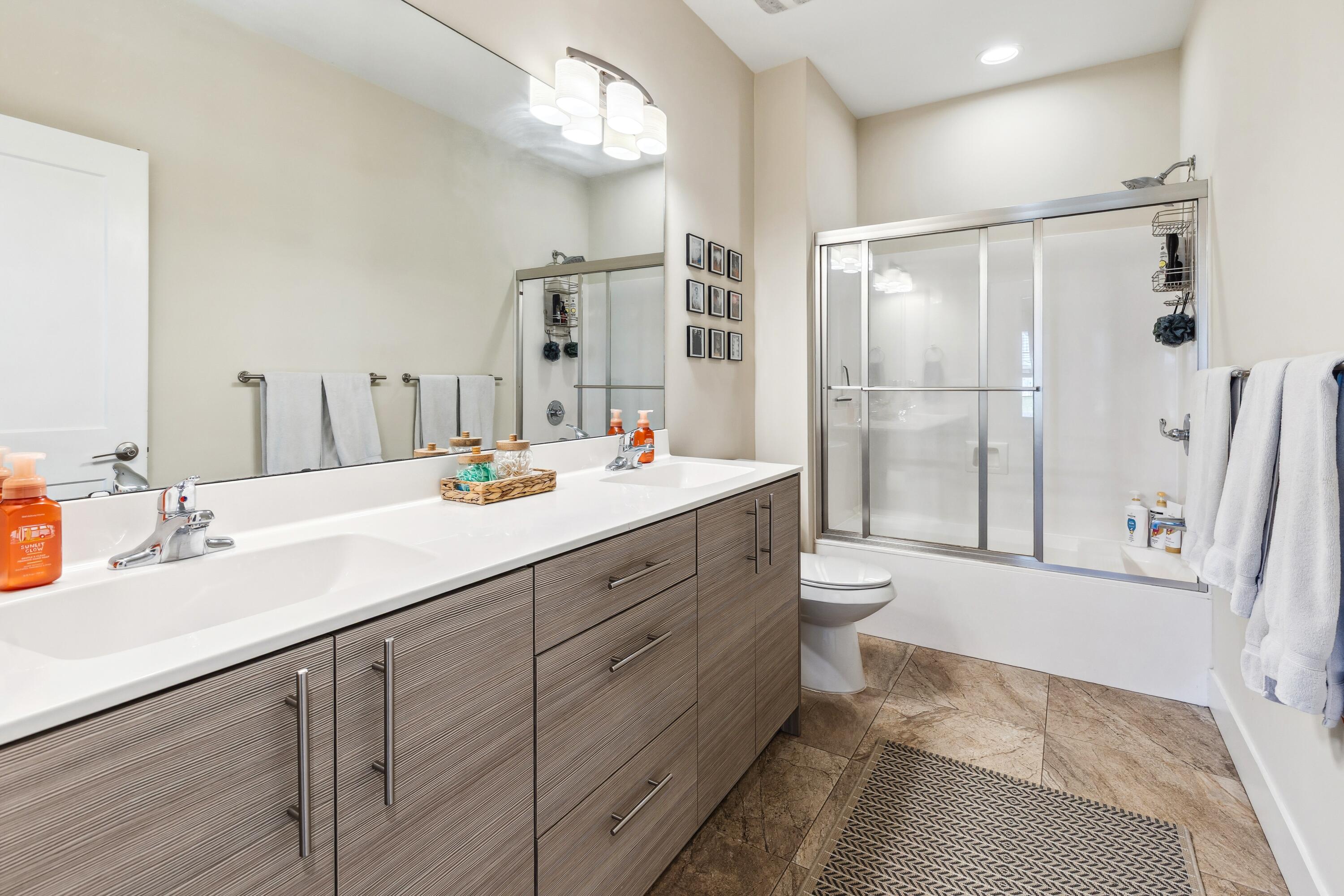 209 Forest Park Drive Santa Rosa Beach, FL 32459 - Photo 25 of 49 a bathroom with a double vanity sink toilet mirror and shower