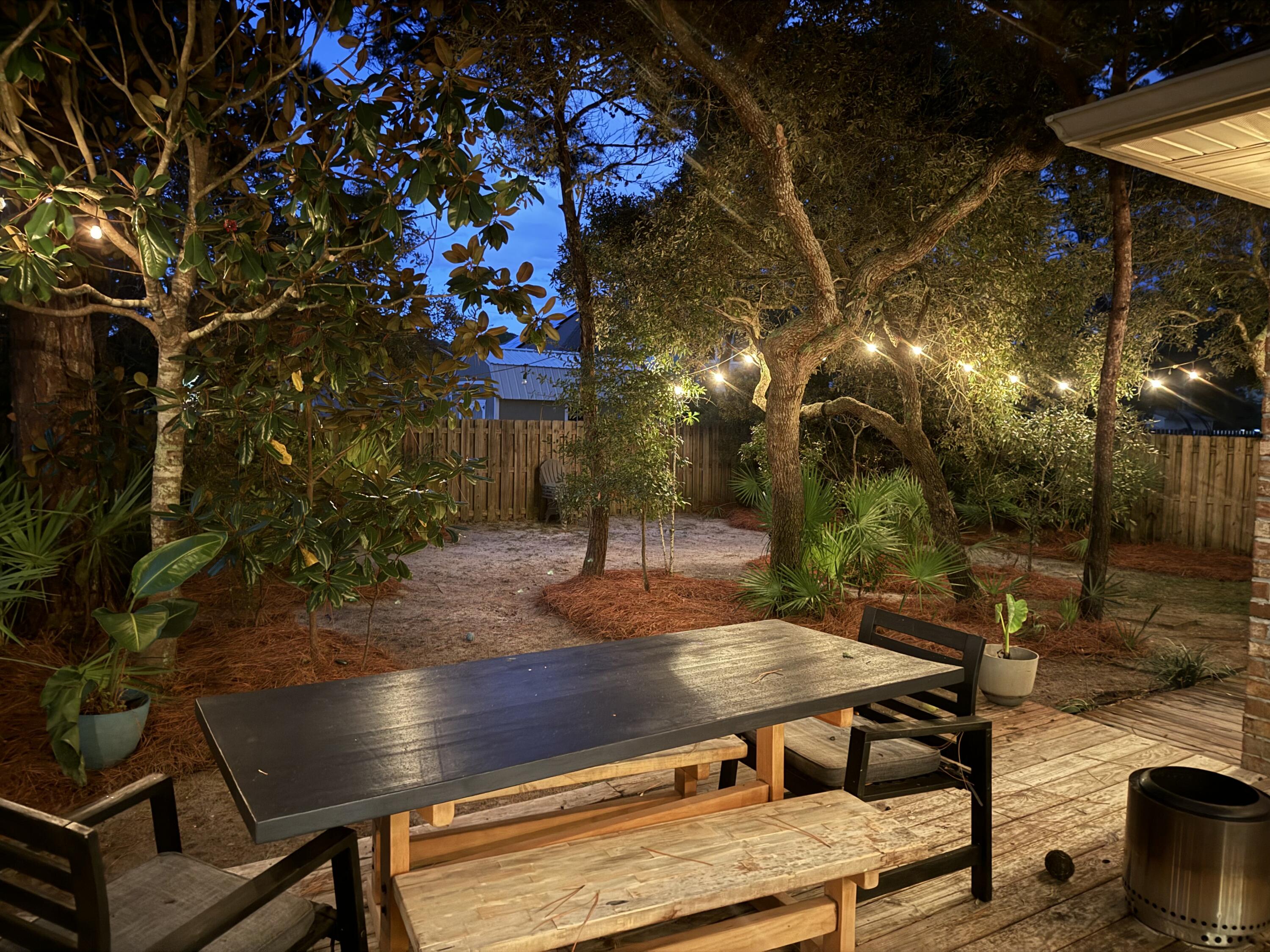 209 Forest Park Drive Santa Rosa Beach, FL 32459 - Photo 26 of 49 a view of a backyard with sitting area