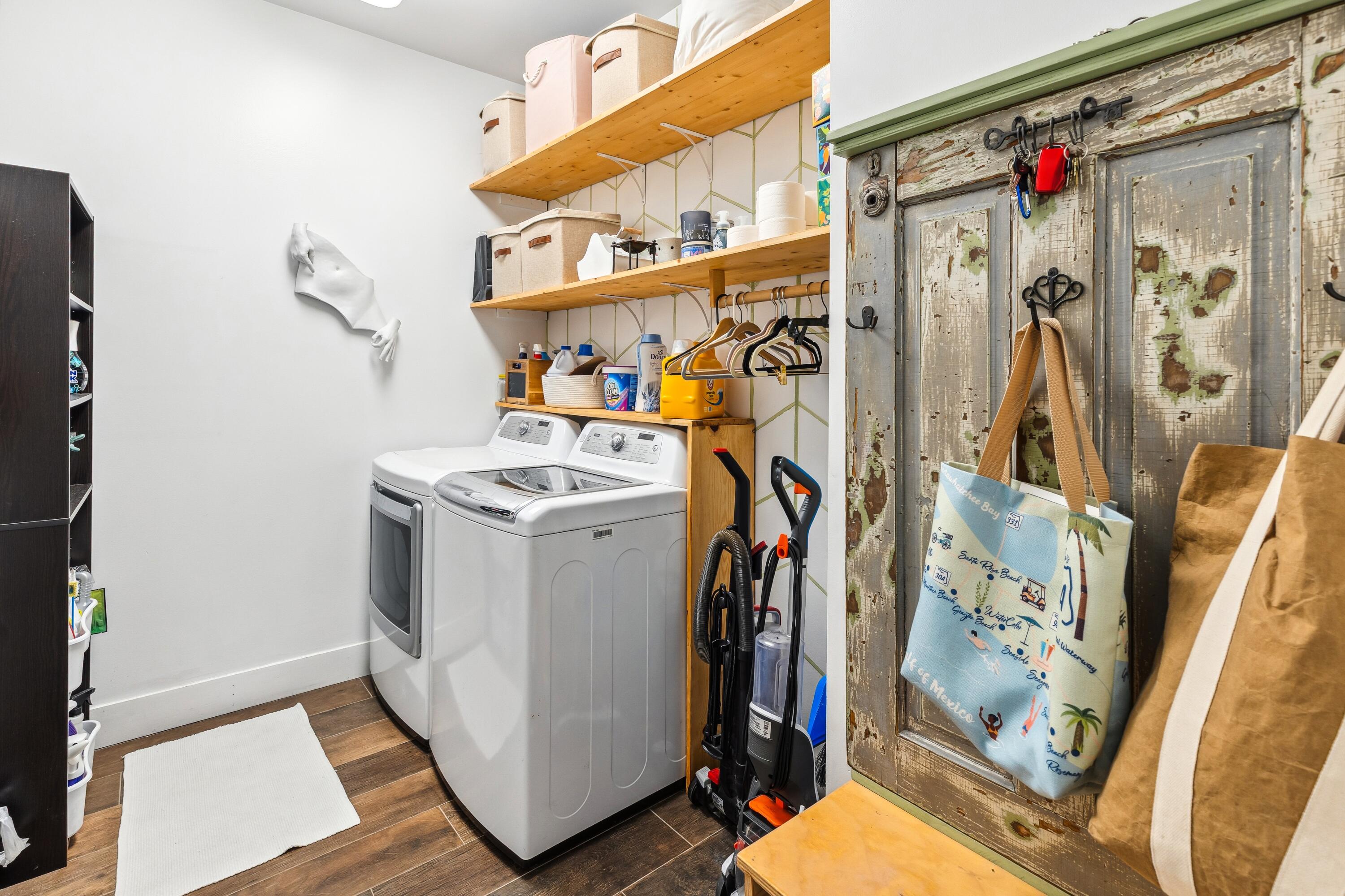 209 Forest Park Drive Santa Rosa Beach, FL 32459 - Photo 27 of 49 a view of walk in closet with clothes and shoes