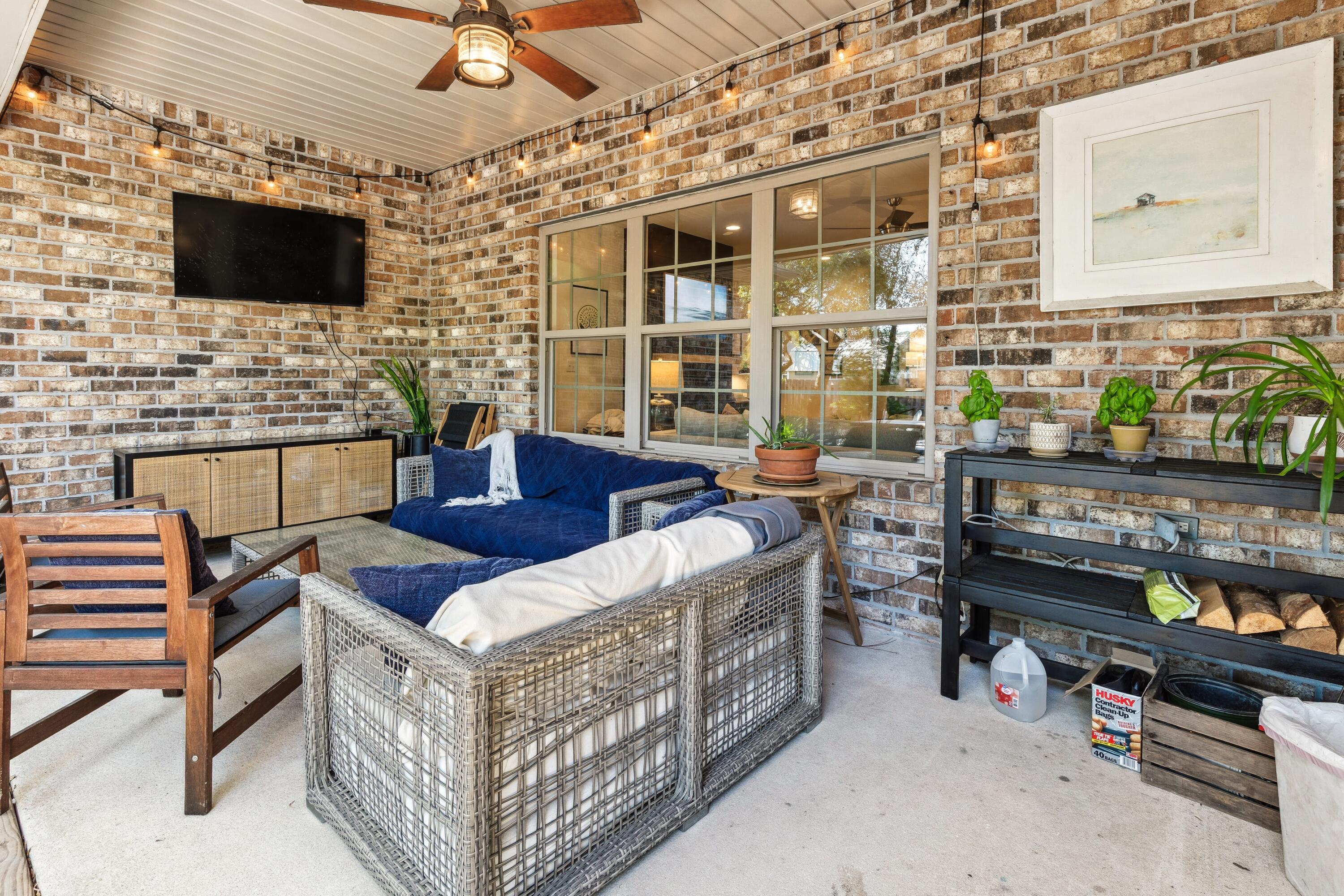 209 Forest Park Drive Santa Rosa Beach, FL 32459 - Photo 28 of 49 a outdoor living space with furniture and a flat screen tv