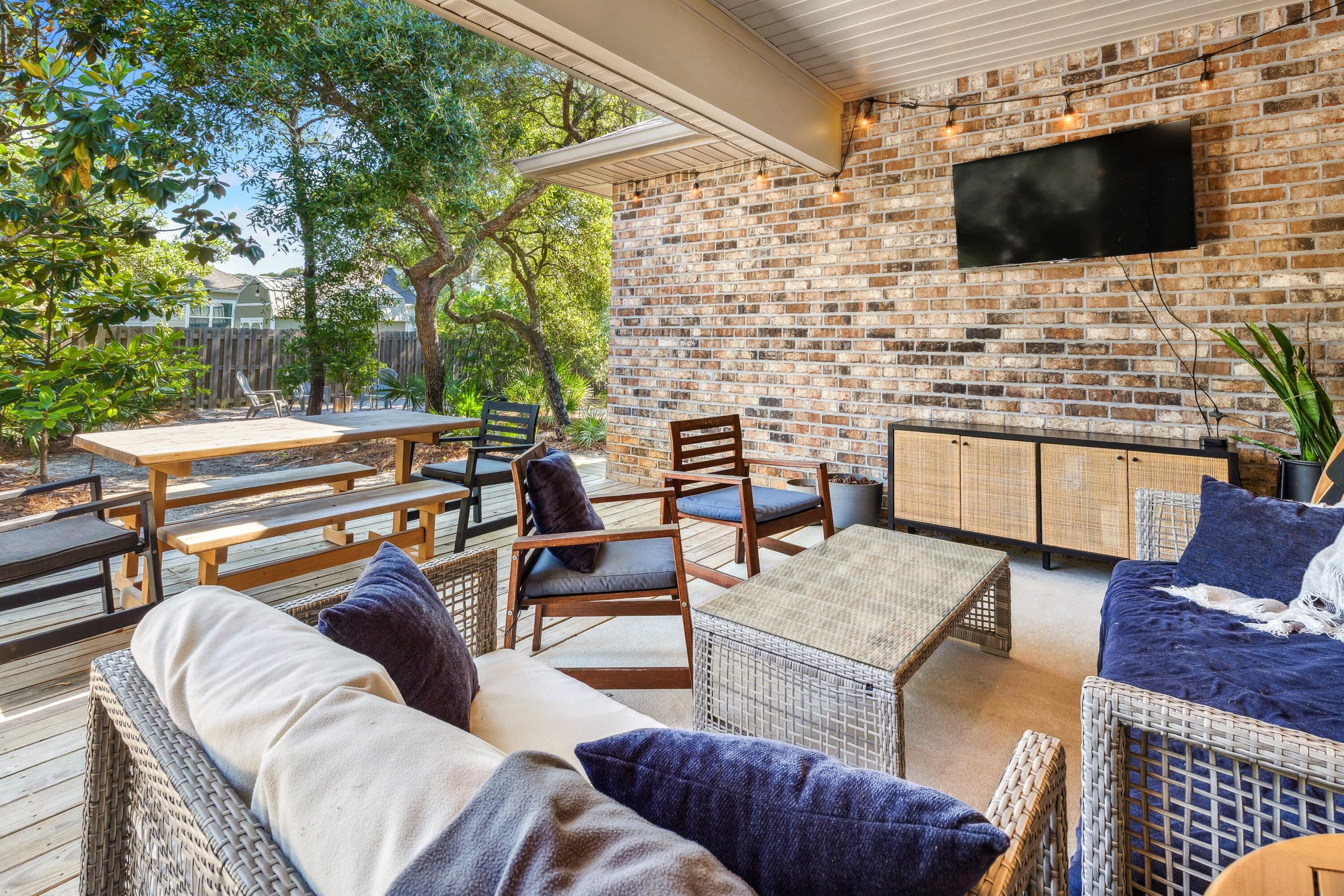 209 Forest Park Drive Santa Rosa Beach, FL 32459 - Photo 29 of 49 a outdoor living space with furniture and a flat screen tv