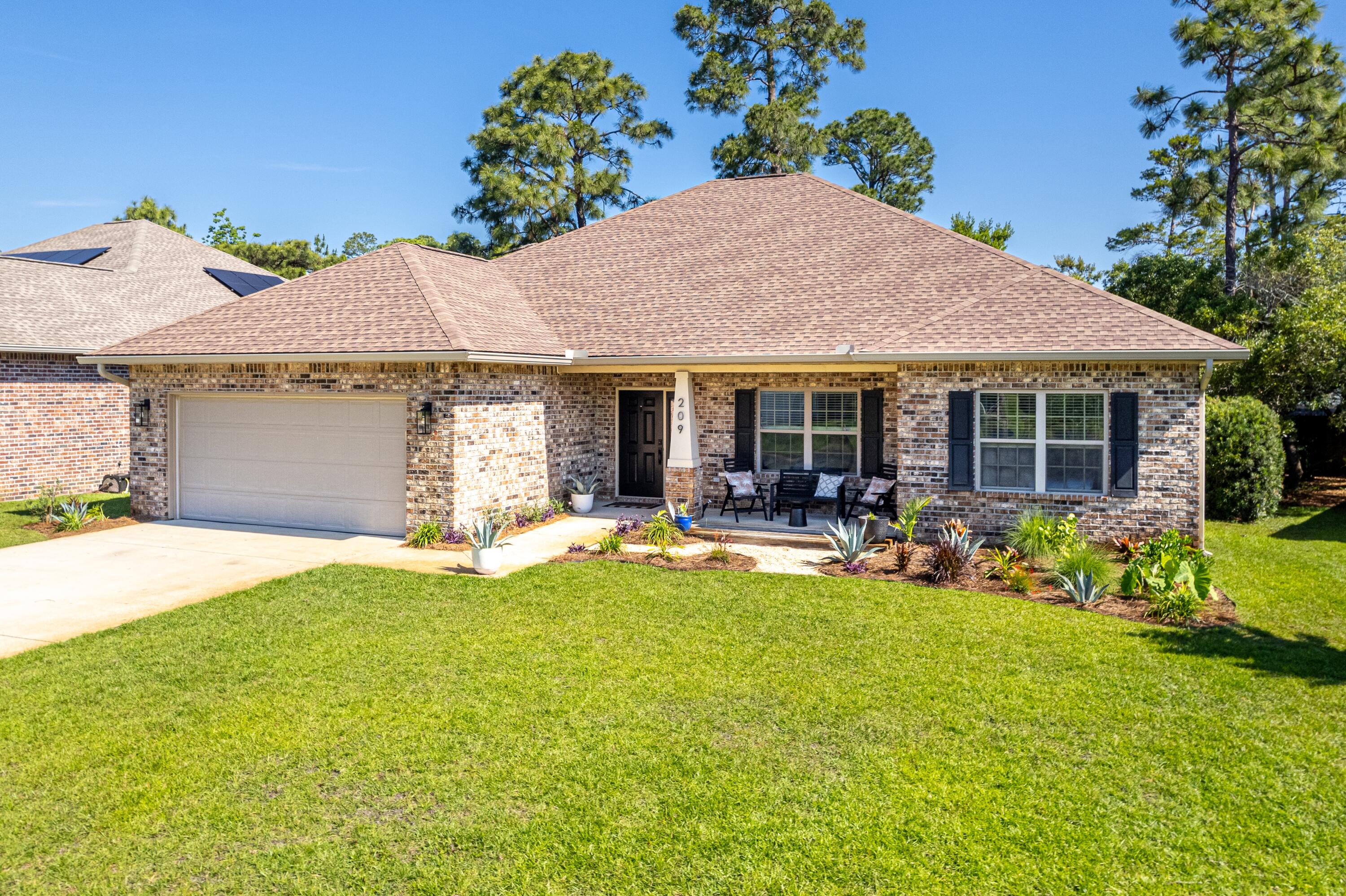 209 Forest Park Drive Santa Rosa Beach, FL 32459 - Photo 42 of 49 a view of a house with swimming pool and porch