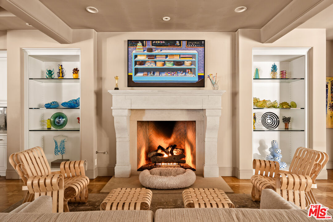 4009 Valley Meadow Road Encino, CA 91436 - Photo 12 of 32 a living room with furniture and a fireplace