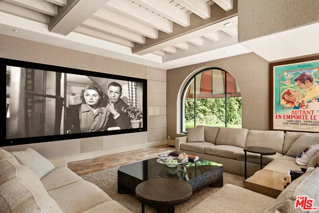 a room with lots of furniture and white walls