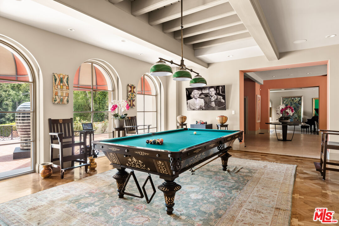 4009 Valley Meadow Road Encino, CA 91436 - Photo 14 of 32 a room with lots of furniture and white walls