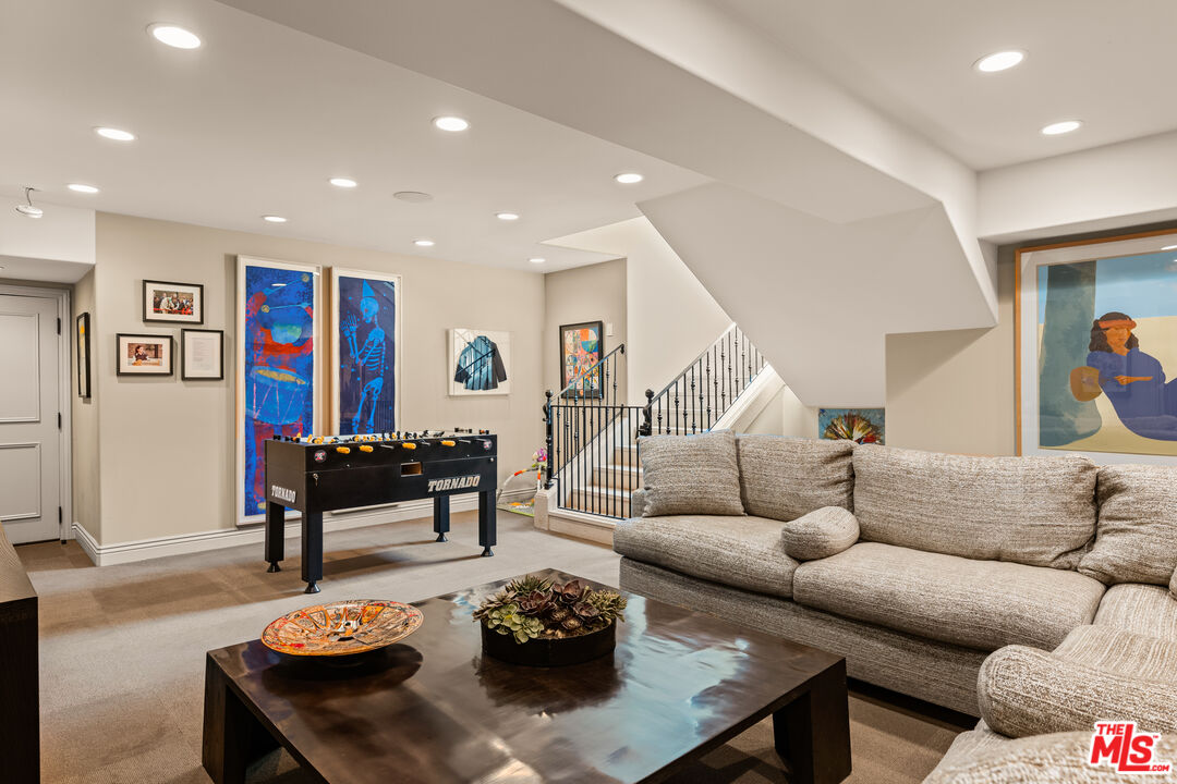 4009 Valley Meadow Road Encino, CA 91436 - Photo 16 of 32 a living room with furniture and wooden floor