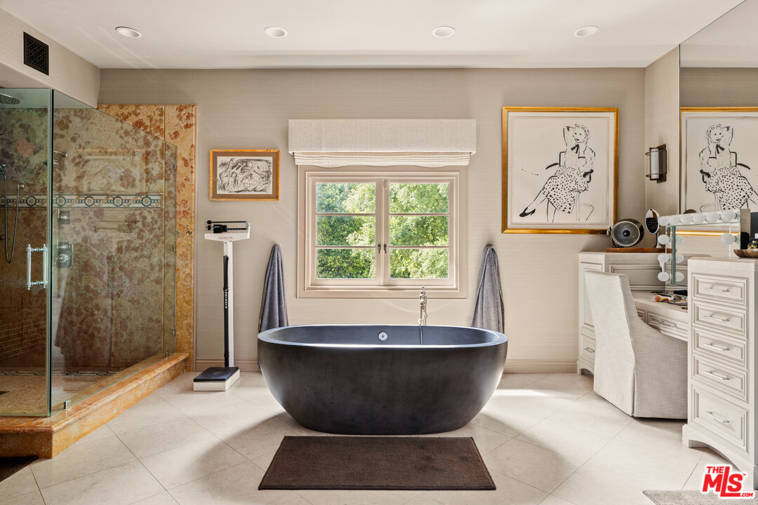 4009 Valley Meadow Road Encino, CA 91436 - Photo 21 of 32 a living room with a couch and a window