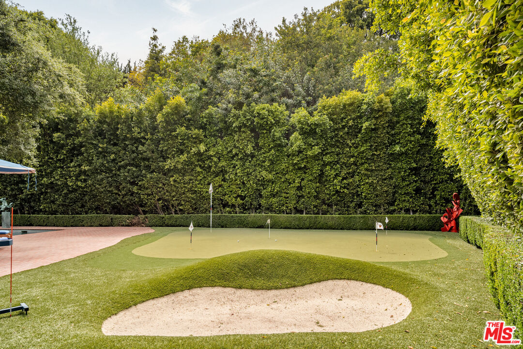 4009 Valley Meadow Road Encino, CA 91436 - Photo 26 of 32 a view of a swimming pool with a outdoor space