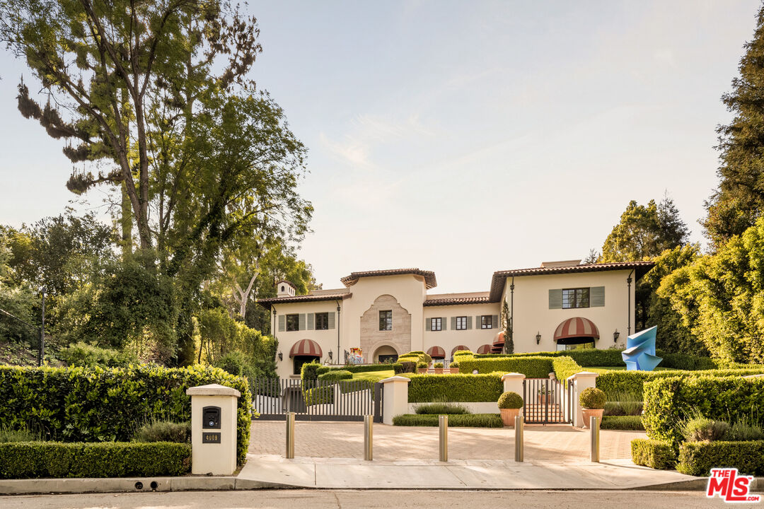 4009 Valley Meadow Road Encino, CA 91436 - Photo 29 of 32 a front view of a house with garden
