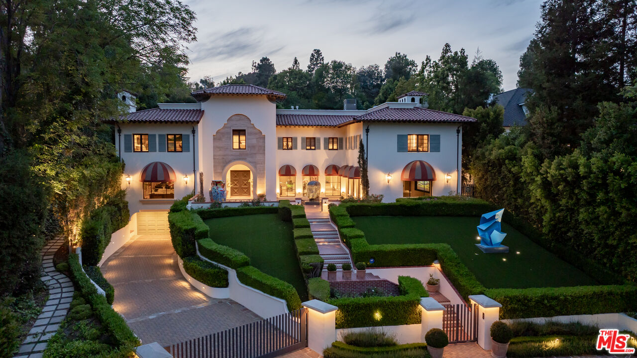 4009 Valley Meadow Road Encino, CA 91436 - Photo 30 of 32 a front view of a house with garden