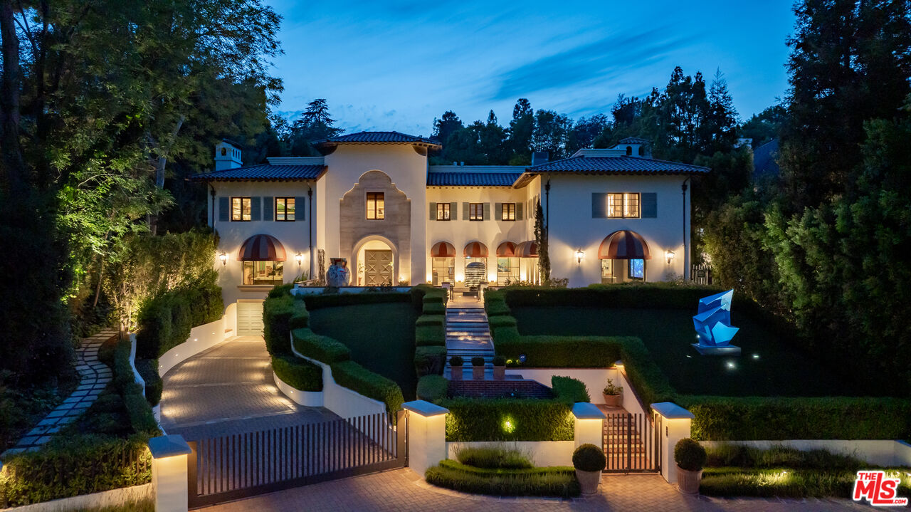 4009 Valley Meadow Road Encino, CA 91436 - Photo 31 of 32 a front view of a house with a yard