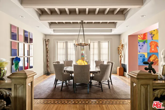 a living room with a fireplace and a large window