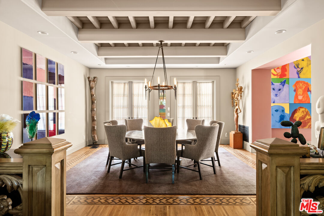 4009 Valley Meadow Road Encino, CA 91436 - Photo 8 of 32 a view of a dining room with furniture a chandelier and large windows