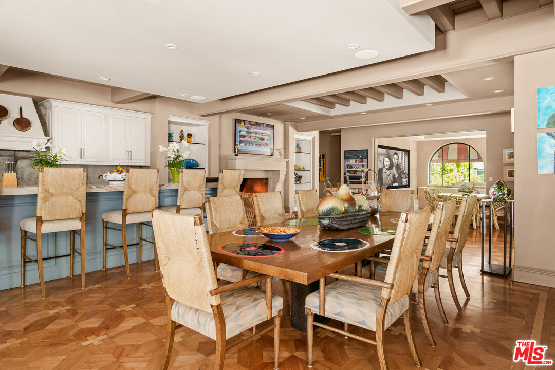 4009 Valley Meadow Road Encino, CA 91436 - Photo 10 of 32 a view of a dining room with furniture and wooden floor