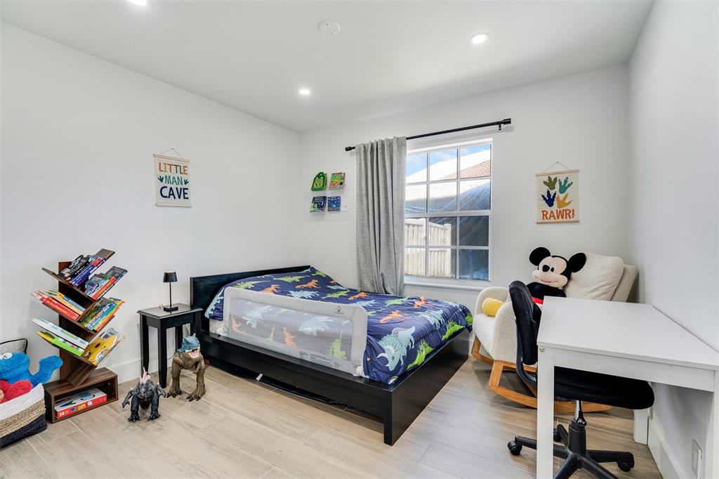 558 Slippery Rock Road Weston, FL 33327 - Photo 13 of 28 a bed room with a bed and a chair