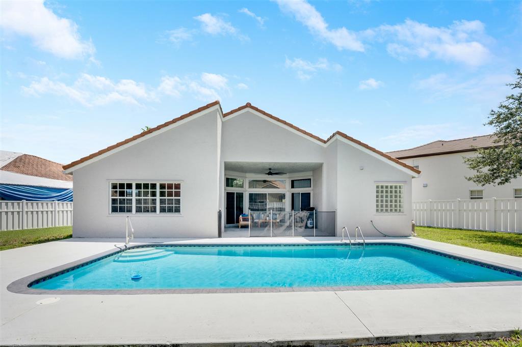 558 Slippery Rock Road Weston, FL 33327 - Photo 17 of 28 a house view with swimming pool and porch