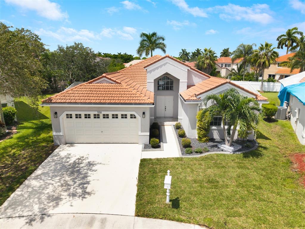 558 Slippery Rock Road Weston, FL 33327 - Photo 28 of 28 a view of a house with a yard