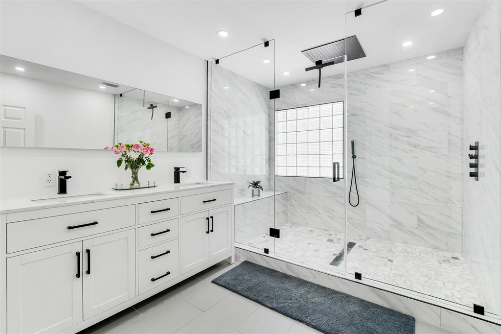 558 Slippery Rock Road Weston, FL 33327 - Photo 6 of 28 a bathroom with a bathtub sink vanity and mirror