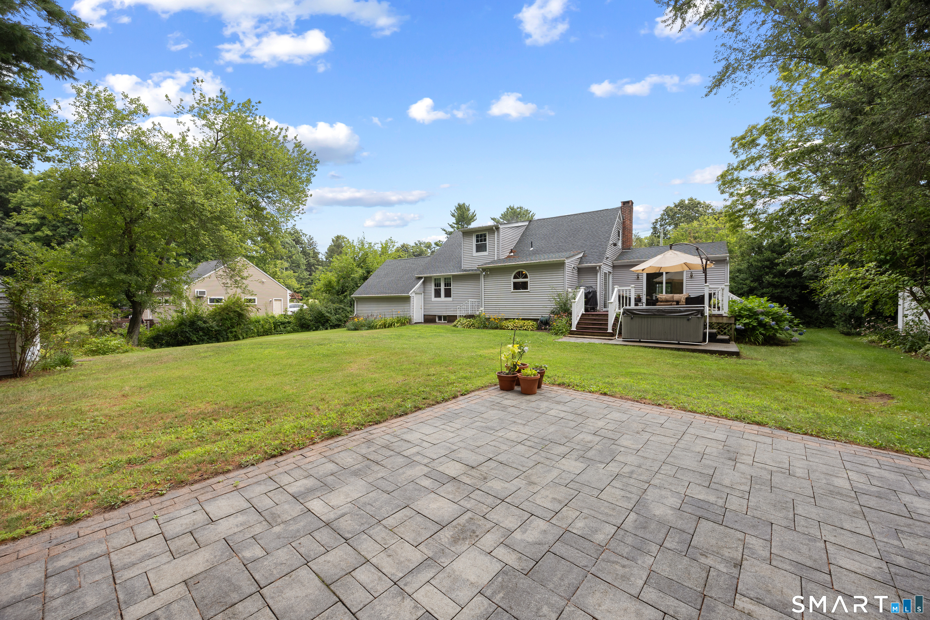 301 Wiese Road Cheshire, CT 06410 - Photo 34 of 40 A separate patio for sunbathing and firepit night adds more outdoor space , what more could be needed ?