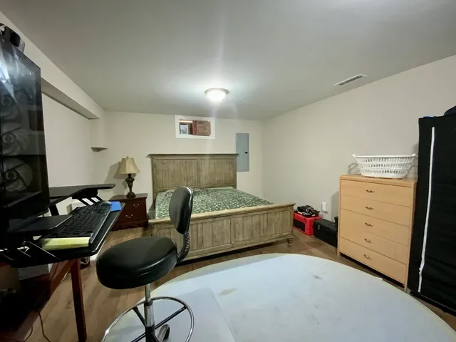 a bedroom with furniture and a bed