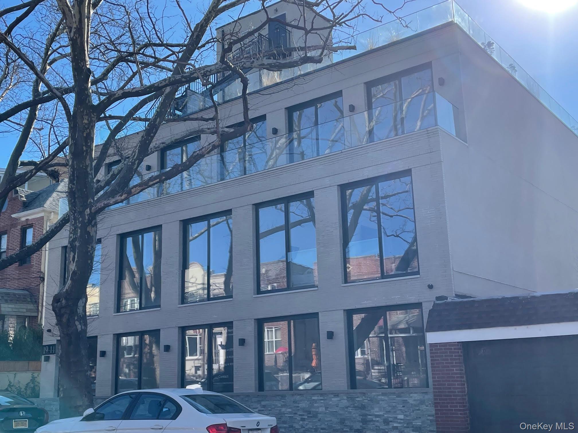 19-14 21st Road, Unit 2A Queens, NY 11105 - Photo 19 of 19 a front view of a building with balcony
