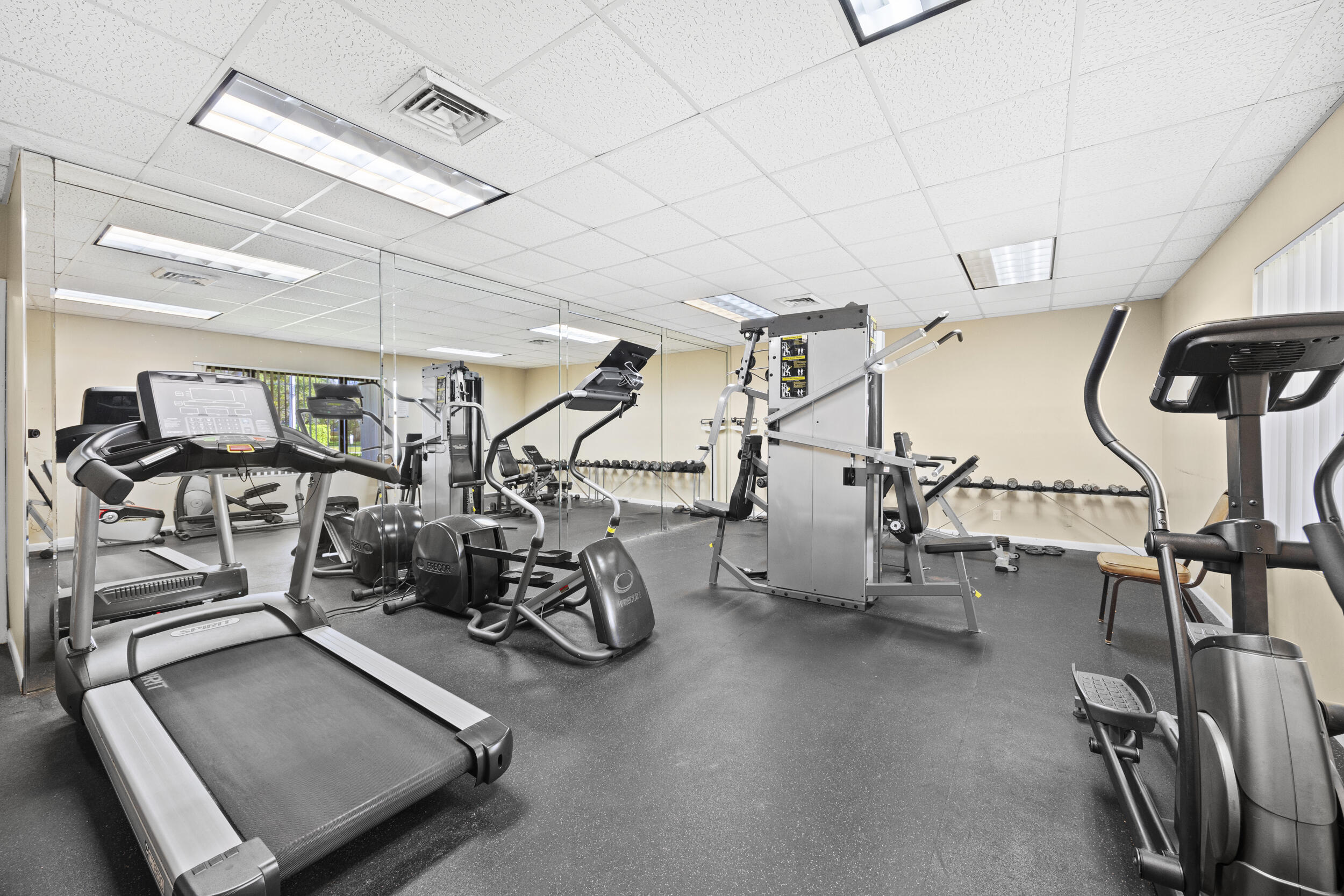 2975 Southwest 22nd Avenue, Unit 1080 Delray Beach, FL 33445 - Photo 4 of 67 a view of a room with gym equipment