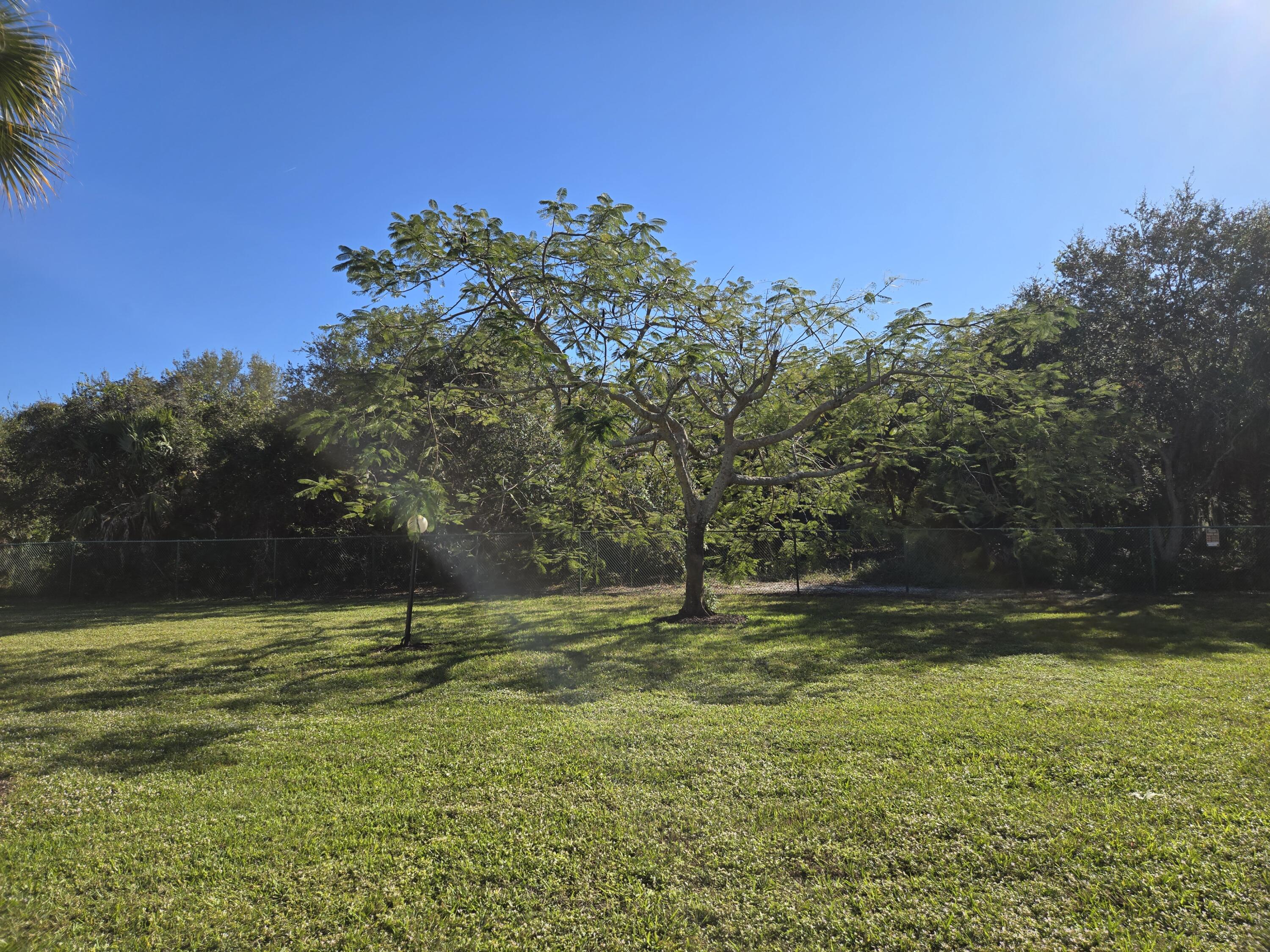 2975 Southwest 22nd Avenue, Unit 1080 Delray Beach, FL 33445 - Photo 54 of 67 a view of outdoor space with deck and yard
